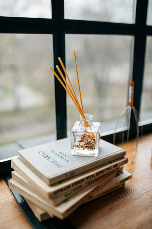 Top aromatherapy scents for the home office; aromatherapy tips; aromatherapy oils; reed diffuser; books